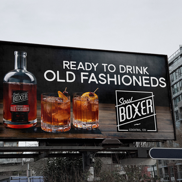 A billboard that says ready to drink soulboxer old fashioneds.