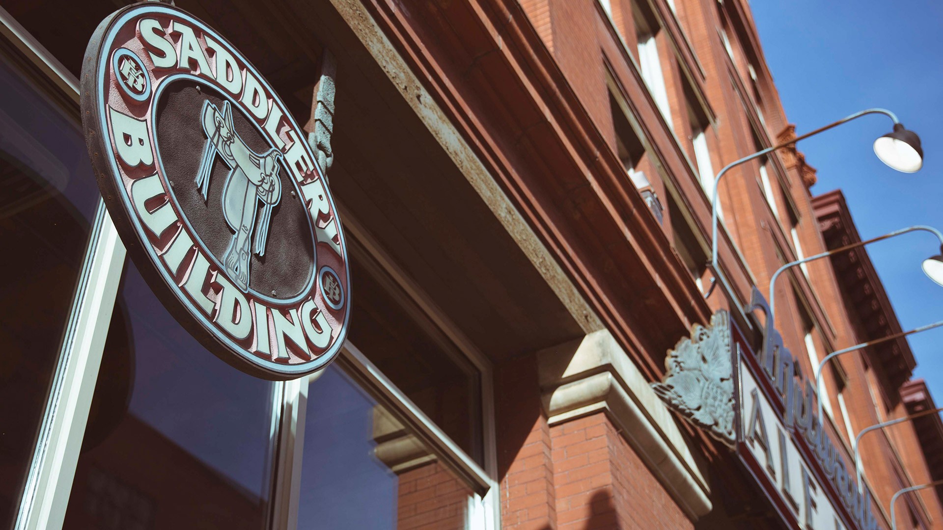 The outside saddlery building sign.