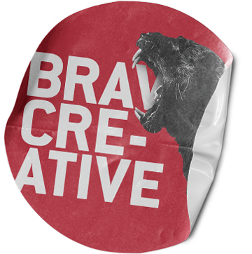 A red sticker that says brave creative.
